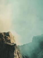 A serene landscape featuring rocky formations under a soft, hazy sky. photo