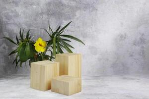natural wooden block with leaves and a flower photo