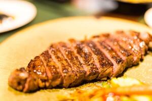 Barbecue grilled rump cap or picanha beef meat steak in a dish photo