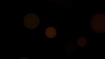 Exciting flying bokeh flashing light dancing, red and yellow circles. video