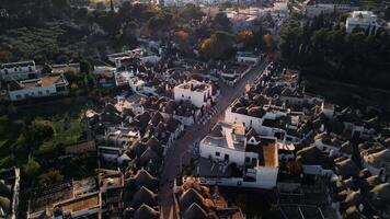Flight over the center of Alberobello. The city is famous for the amazing architecture of the Truli houses. Alberobello is visited by millions of tourists a year. Sunset over Truli. video