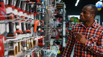 Man Buying Discounted Screwdriver in Hardware Store video