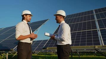 Engineers Discuss Solar Station Performance and Shake Hands video