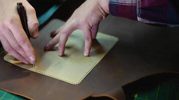 Artisan Marking Leather with Precision Using a Template and Awl video