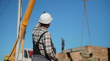 Construction Foreman Directing Crane Operator on Site video