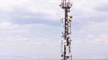 telecommunication tower in front of cloudy sky video