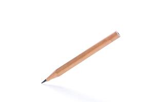 Simple wooden pencil positioned vertically on a white background showcasing a sharp tip for writing or drawing photo