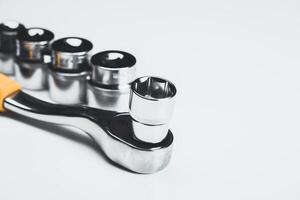 Precision tool set displayed with a socket wrench and sockets on a clean surface photo