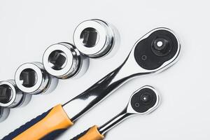 Sleek set of chrome socket wrenches arranged on a white background for tool enthusiasts and DIY projects photo