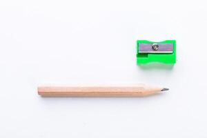 Quality pencil and sharpener placed neatly on a clean surface ready for drawing or writing activities photo
