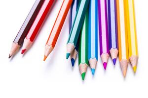 Colorful collection of sharpened pencils arranged in a vibrant display on a white background photo