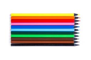 Collection of colorful pencils arranged in a row on a white background for creative projects and art activities photo