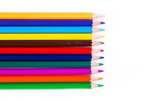 Vibrant colored pencils arranged neatly on a white background ideal for artistic creativity and design projects photo
