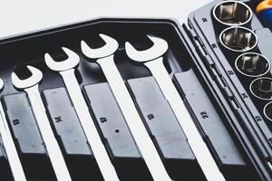 High-quality set of wrenches organized in a compact tool box for mechanics and DIY enthusiasts photo