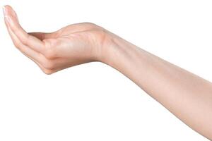 Reaching hand extended towards an unseen object in a neutral setting with soft lighting photo