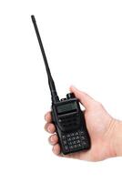 Handheld communication device being held by an individual in a casual setting during daylight photo