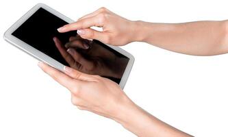 Hands interact with a touchscreen tablet displaying a black screen in a modern setting during a productive moment photo