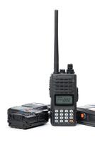 Portable two-way radio with antenna and battery pack positioned for communication use during outdoor activities photo