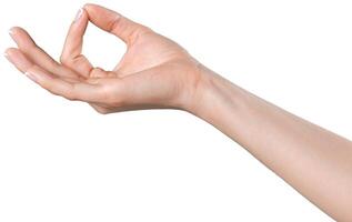 Hand gesture displaying the sign for approval or agreement in neutral lighting photo