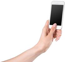 Hand holding a smartphone with a blank screen against a white background in a casual setting photo