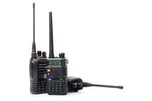 Different types of handheld radios shown together on a white background for communication needs in various settings photo
