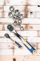 Tools for mechanical work organized on wooden table ready for use in a garage or workshop setting photo