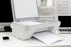Home office setup with a printer scanning documents during a busy workday photo
