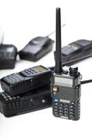 Modern communication tools on display with various handheld radios in different sizes and designs photo
