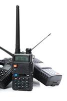 Multiple handheld radios displayed on a white background showcasing their features and designs photo