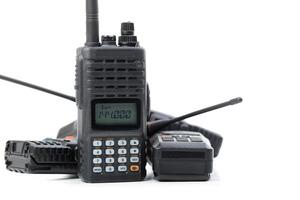 Multiple handheld radios stacked together showcasing various features for communication purposes photo