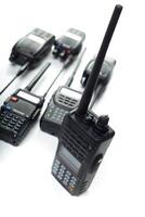 Various handheld radios displayed on a white background highlighting communication devices for professional use photo