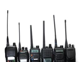 Various models of two-way radios arranged in a row showcasing different designs and features for communication needs photo