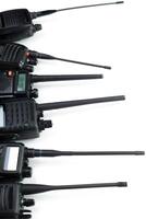 Communication devices arranged in a row showcasing design and functionality for various uses in emergency services and industrial settings photo
