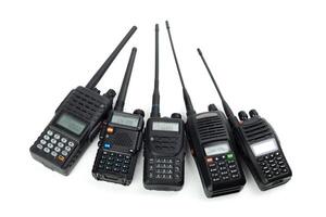 Various communication devices arranged in a row with different designs and features for reliable radio transmission photo