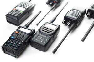 Various models of two-way radios displayed on a white background for communication technology enthusiasts photo