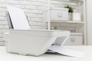 Modern printer in a well-organized workspace printing documents on crisp white paper photo