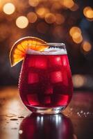 Refreshing red beverage served in a glass garnished with an orange slice and bubbles on a table with a warm bokeh background photo