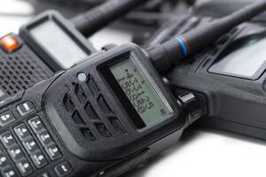 Various types of communication devices arranged close together on a surface for inspection and use photo