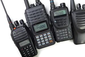 Various models of two-way radio communication devices on a white background photo