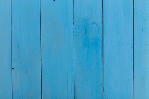 Bright blue wooden planks create a vibrant textured background perfect for creative designs and coastal themes photo