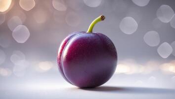 Vibrant purple plum stands out against blurred background with sparkling lights photo