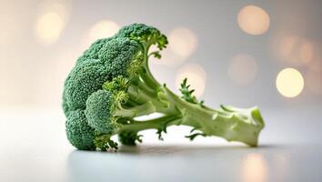 Fresh broccoli with vibrant green florets on a neutral background and soft lighting enhances its natural beauty photo