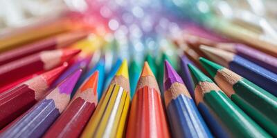 Vibrant assortment of colored pencils arranged in a circular pattern on a white background photo