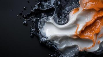 A close up of a liquid with orange and white paint photo