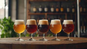 Five different types of beer are lined up on a table photo