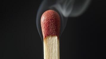 A matchstick with smoke coming out of it photo