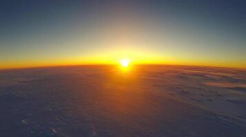 The sun rises over the horizon in the sky photo