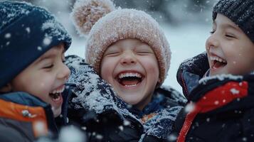 Three children laughing in the snow photo