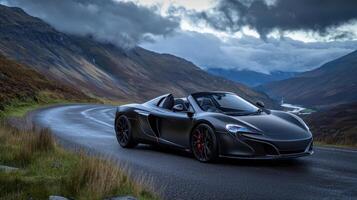 The mclaren 570s spider is driving down a road photo