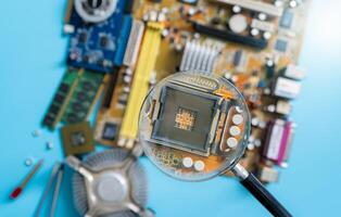 Magnifying glass inspecting electronic circuit board with no computer chip, showcasing quality control, hardware analysis, and innovation in technology design and maintenance. Precision in engineering photo